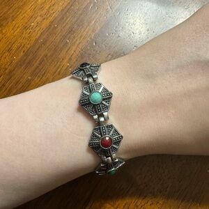 Elegant Silver Bracelet with Red and Green Accents